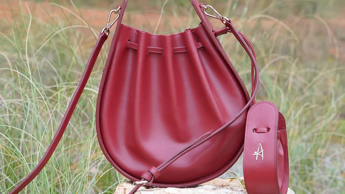 A leather handbag with visible stitching and hardware