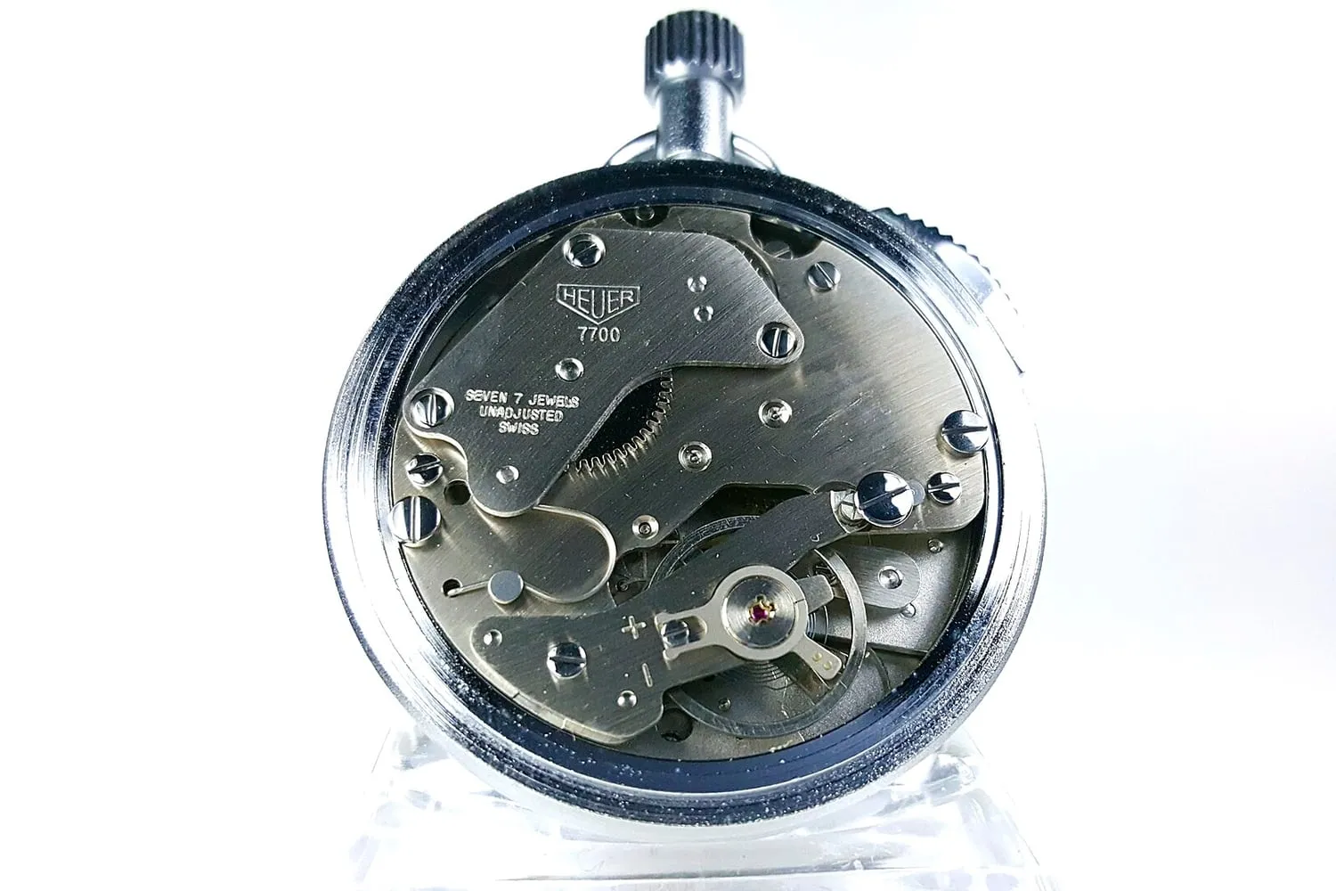 An exposed mechanical watch movement showing its bridges and wheels