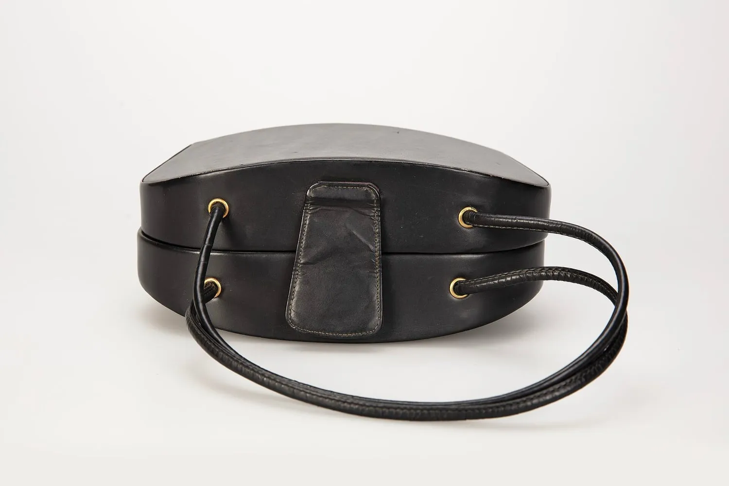 A leather handbag photographed against a plain background